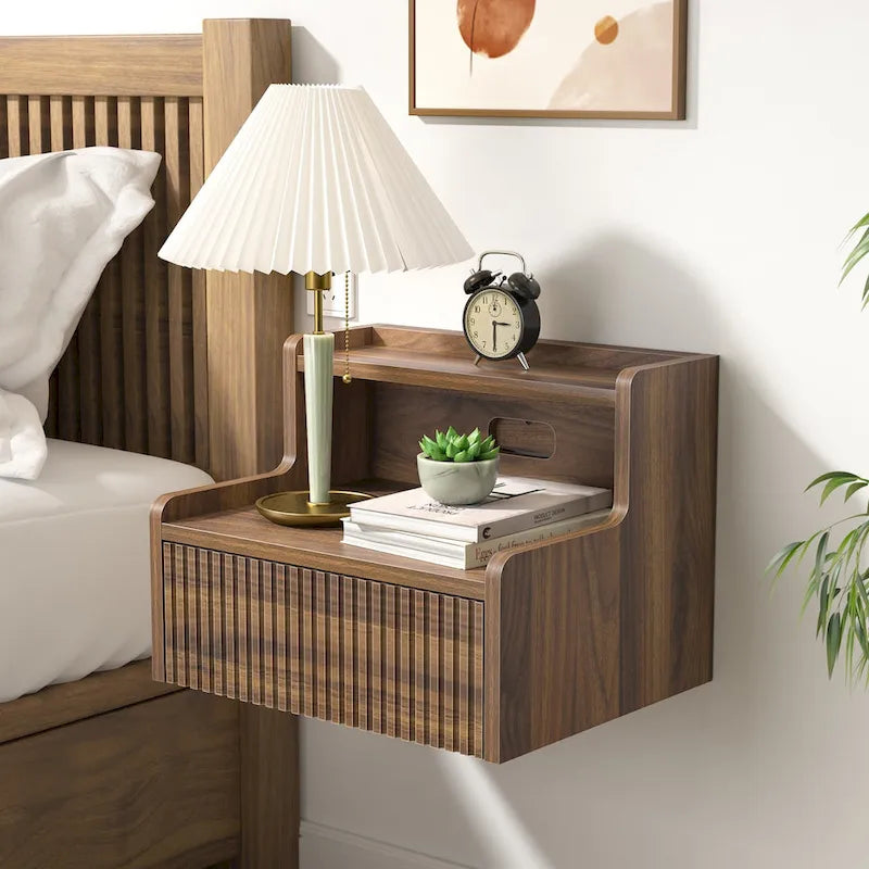 Modern floating bedside table with storage drawers and open shelves.