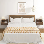 Modern floating bedside table with storage drawers and open shelves.