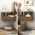 Modern floating bedside table with storage drawers and open shelves.